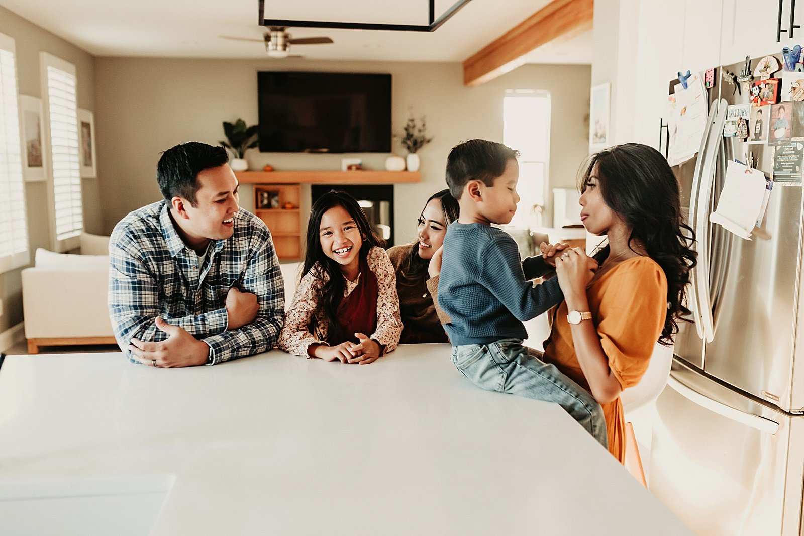  Family gathered in the kitchen for a lifestyle photo shoot in California 