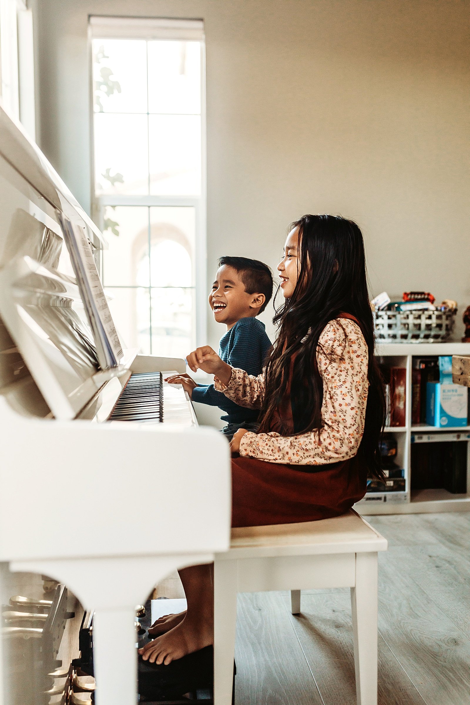  Kids playing the piano at their lifestyle photo session in California  