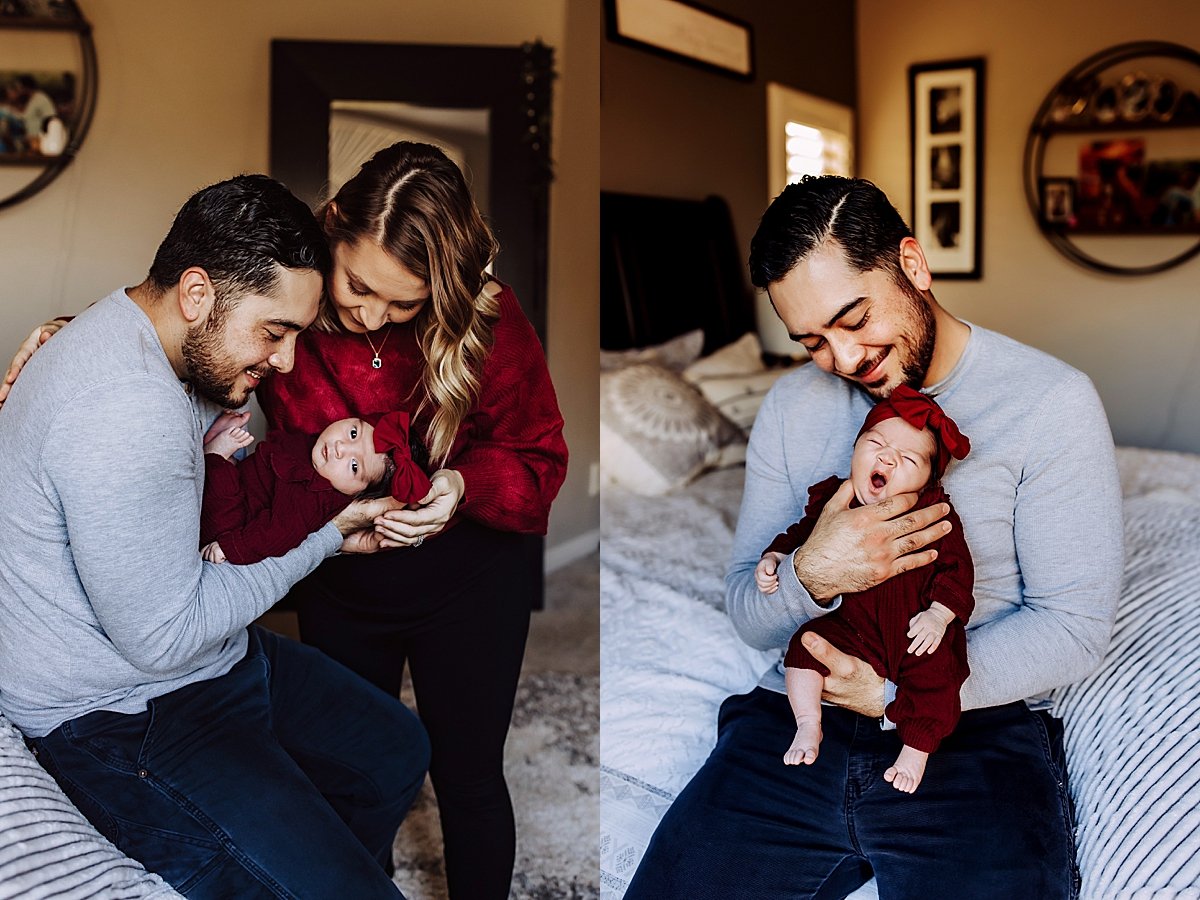  dad holding youngest baby in bedroom by fort Collins newborn photographer 