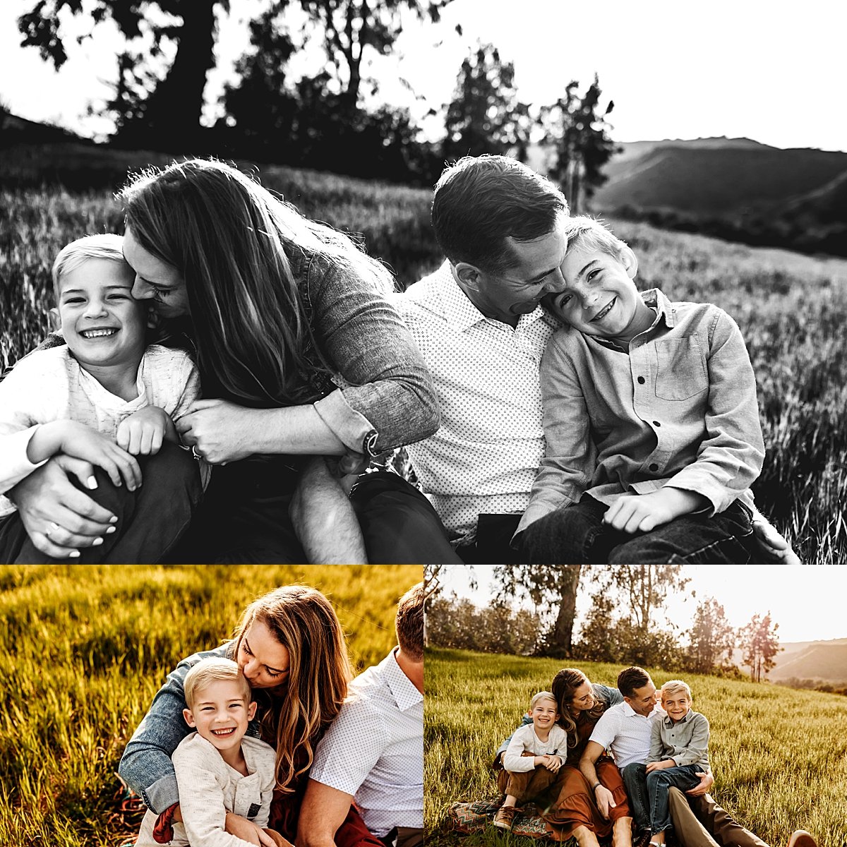  mom and dad kissing their two boys sitting in grass field by fort collins photographer 