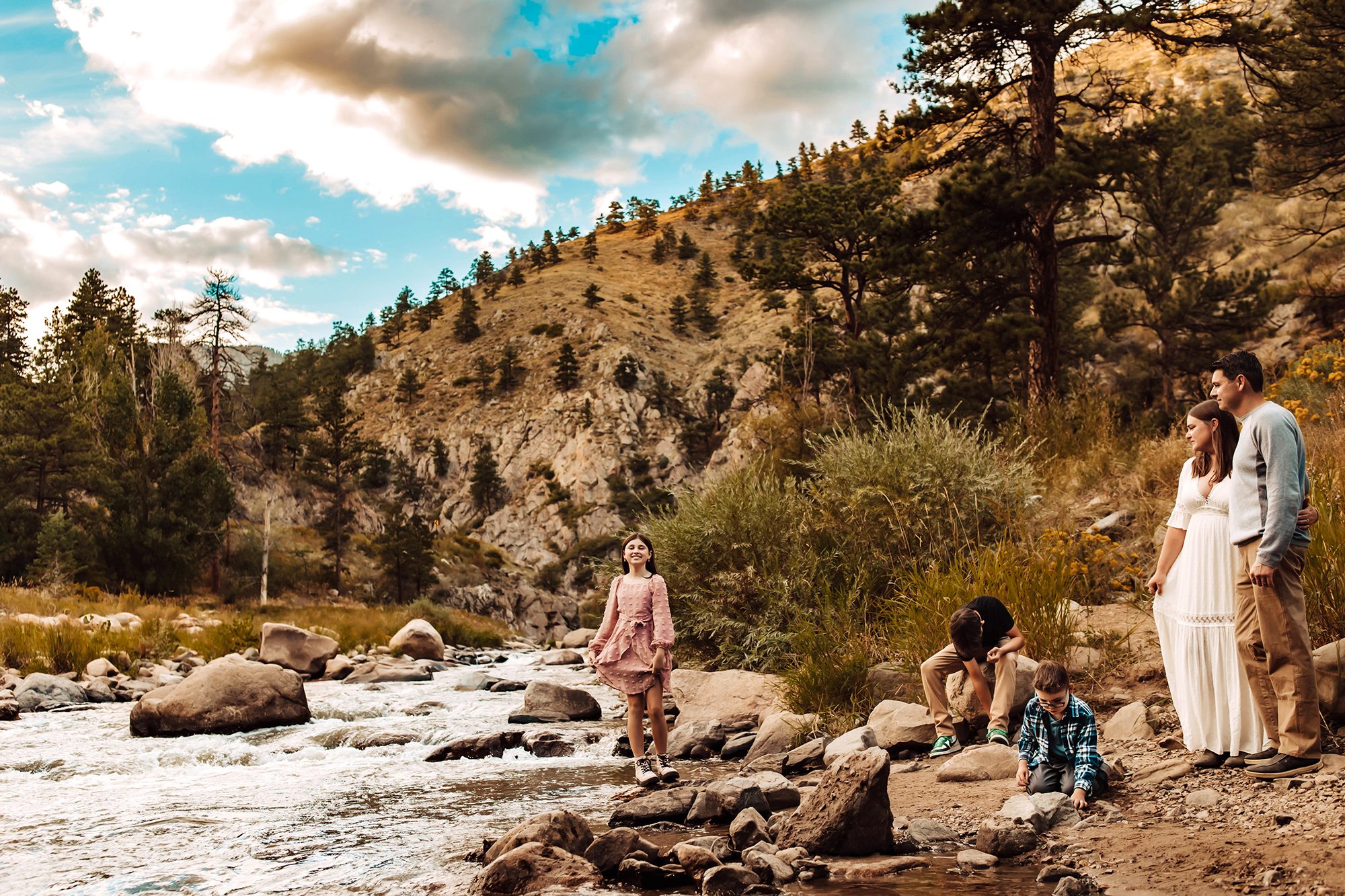 Family time at the river on a fall day in Loveland, Colorado.